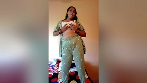 Sexy brunette dancing on the floor with her feet up