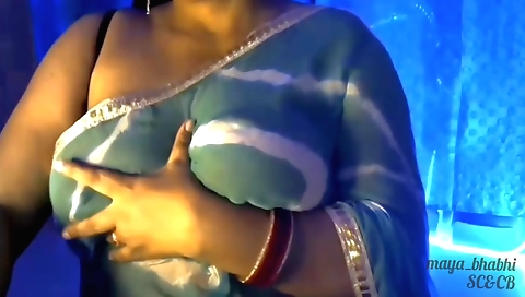 Sexy indian brunette with big tits showing off her curves