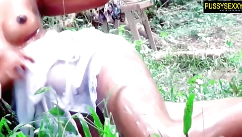 Indian beauty is filming in her car in an outdoor scene