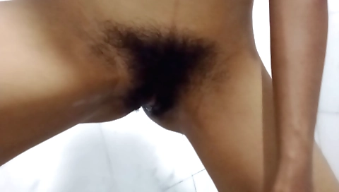 Hairy pussy of a horny Indian girl is playing with it
