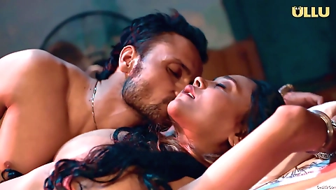 Sexy brunette with big boobs and sexy body is on a sofa