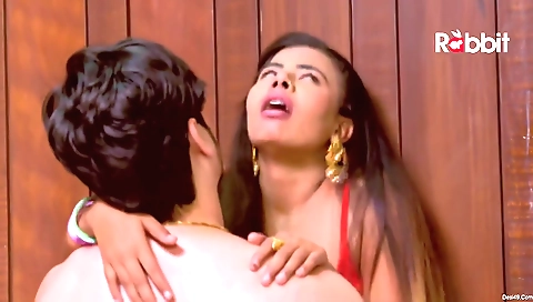 Blonde in a nice green dress is riding a man outdoors