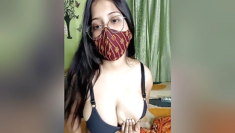 Indian brunette with very nice tits shows them in the bed
