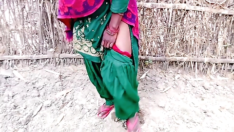 A horny indian girl in a village is fingered and licked outdoors