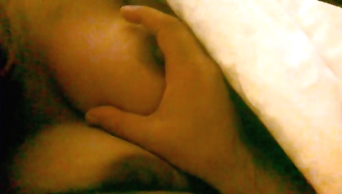 amateur brunette is watching a porn movie with her camera