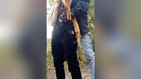 Dude with a bike and his friend ride together outdoors