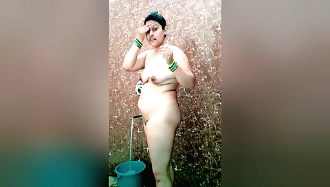 Indian mature milf is in the bathroom with a dildo