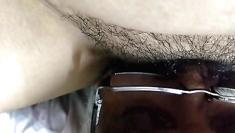 Busty girl shows her hairy pussy in front of the camera