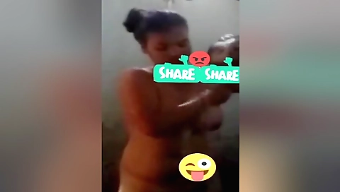 Busty amateur brunette in the shower is stretching her legs