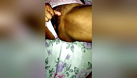 Indian bhabhi spreads her hairy pussy and sucks on it