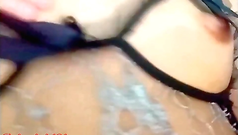 Solo female naked on the sofa in black dress and stockings