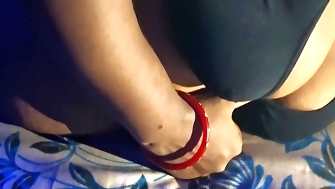 Solo female in a big black bra and stockings with nipples shining