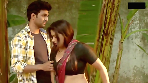 Busty indian lady is playing with a toy on the bed